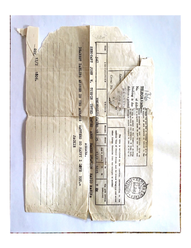 Scan of a aged slip of paper containing telegram correspondance between John W. Turpin and Jackie Turpin. The message reads, "Dearest darling answer is yes arrange matters so happy I love you. -Jackie"