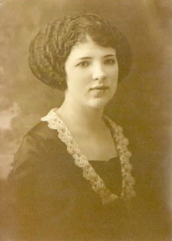 Sepia-toned studio portrait taken in Cumberland, Maryland of Naomi Montgomery Nicholls, a white woman wearing a dark dress with lace edging around the collar.