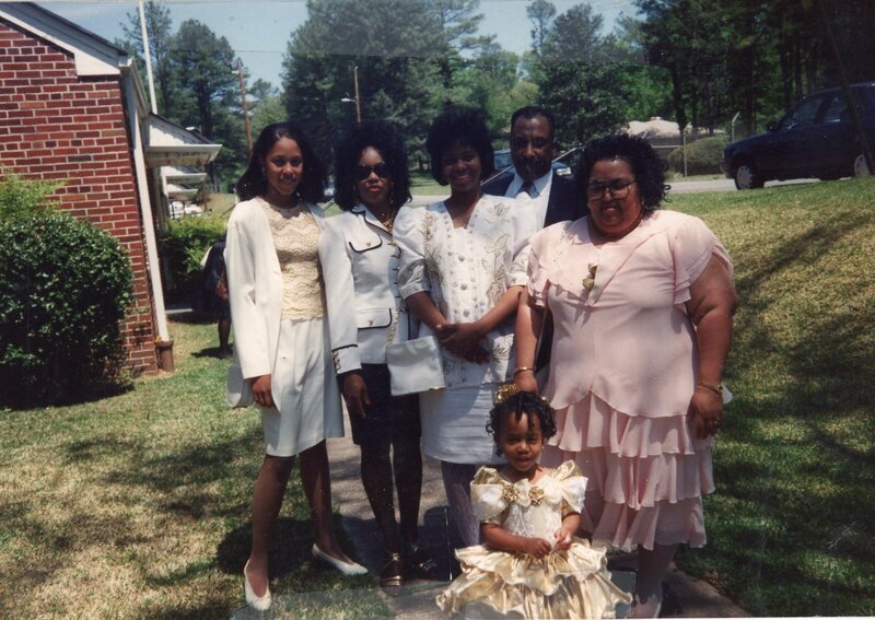 Scan of a color photograph of Sierra King. Sierra standing infront of family members outside of Hoosier Memorial Uniited Methodist Church on Easter Sunday L-R: Jihan, Vickey Williams, Aja King, Lamar Williams & Ethelyn Stephens  