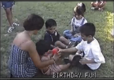 Little David is captured playing a game of hot potato with family at his 4th birthday party.