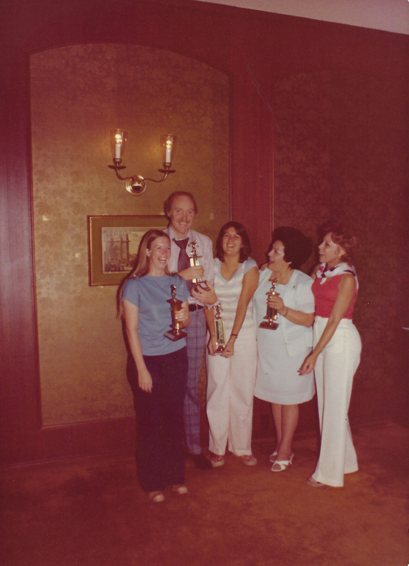 color photo of Bettye Dean and four other individuals holding bowling trophies are posing for a group photo. 