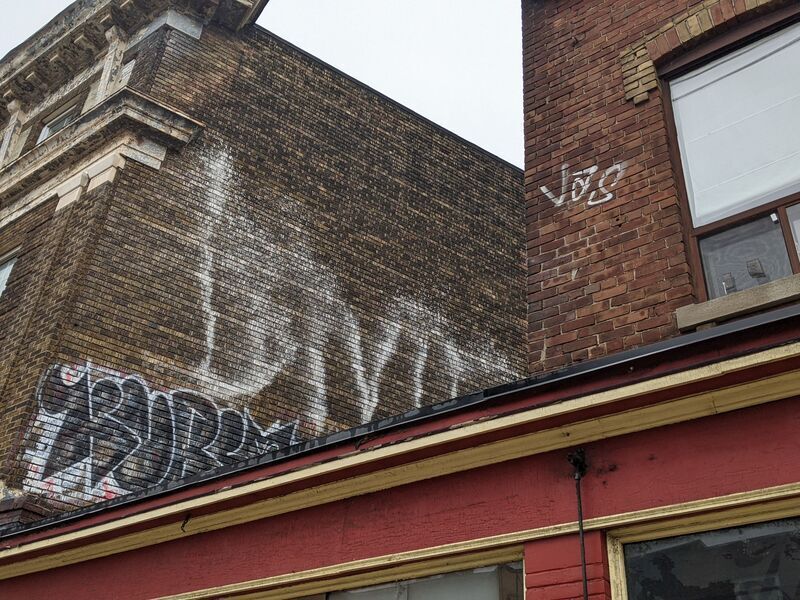 Tags on a brick building