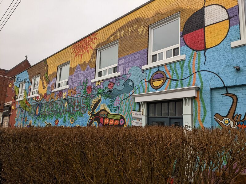 Mural with indigenous imagery spelling out "Roncesvalles"